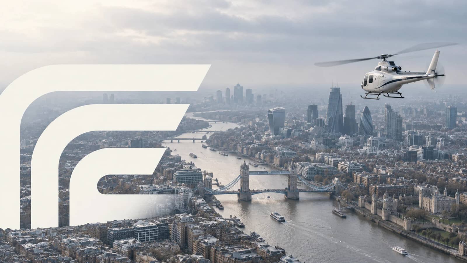 Helicopter flying over the Thames and Tower Bridge in London