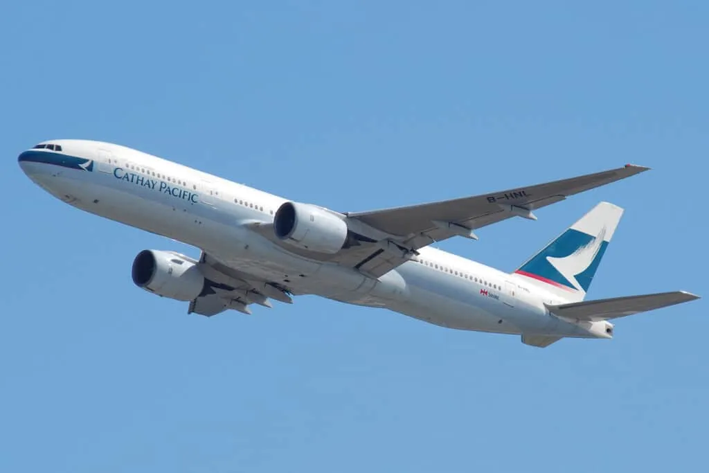 long haul airplane cruising at altitude over clouds