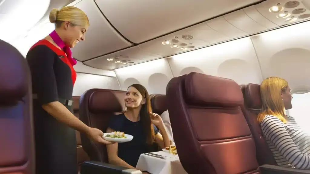 Qantas flight attendants in cabin during service
