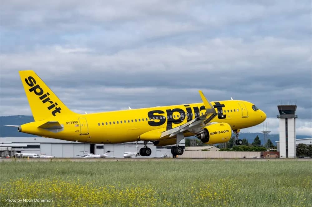 Spirit Airlines yellow aircraft during takeoff