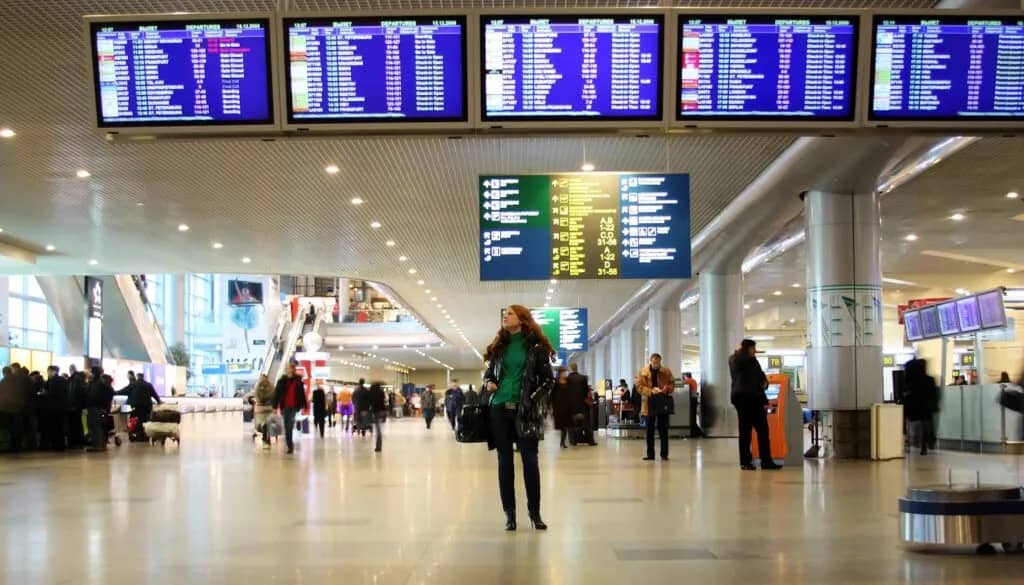 travelers transferring between connecting flights at hub airport