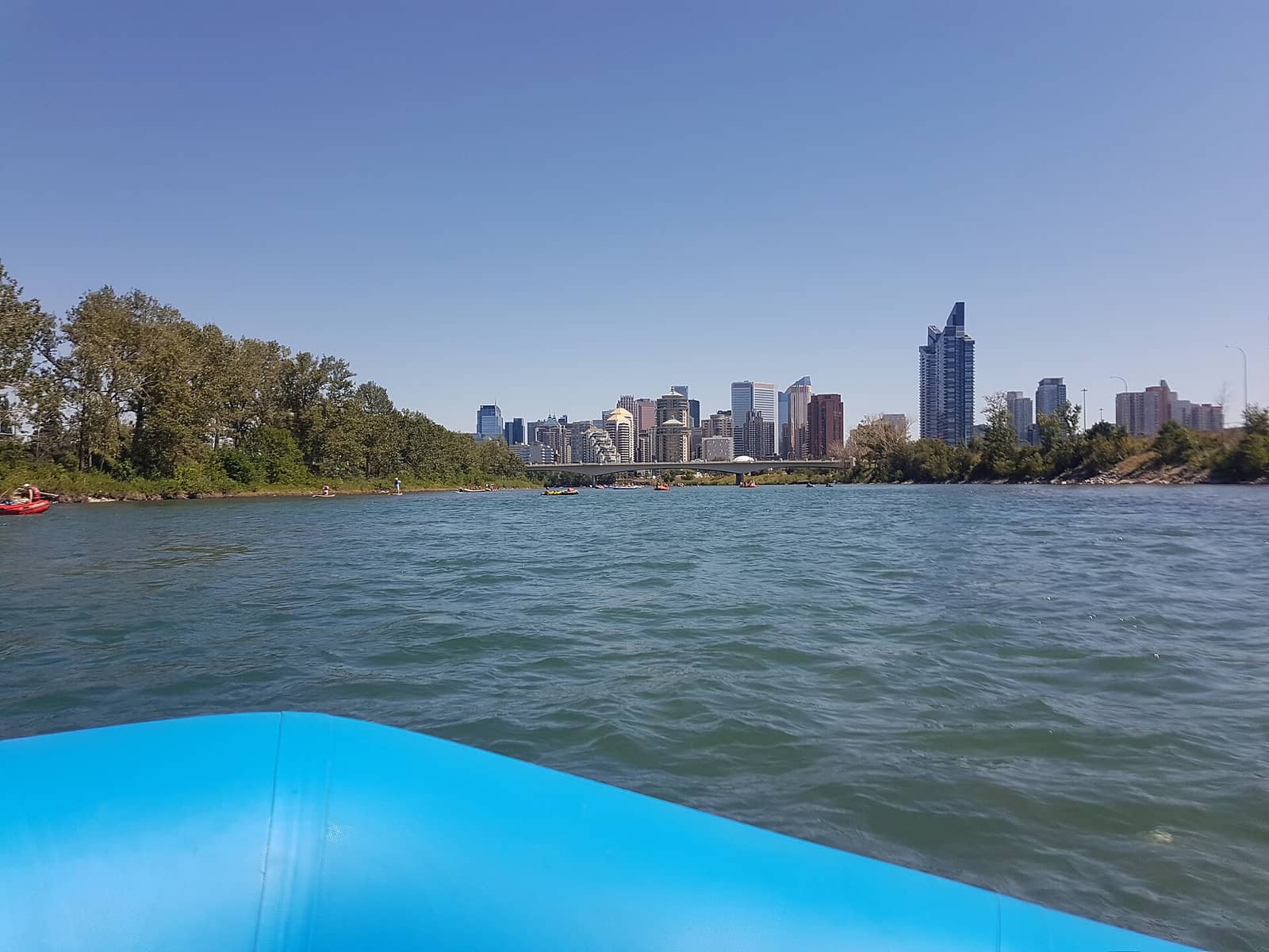 View of Calgary's skyline from a boat on the river