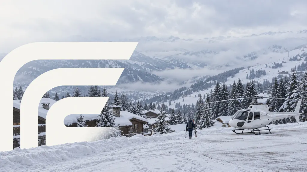 Skier walking to a helicopter beside snowy chalets in Courchevel