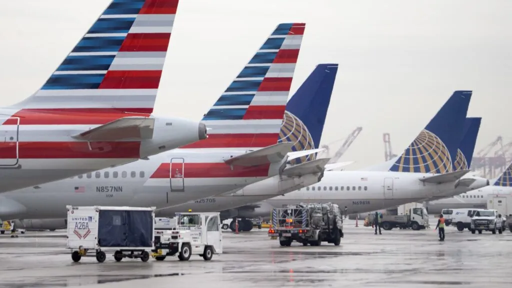 United and American Airlines planes at airport gate