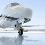 Luxury private jet parked at FBO terminal for first-time passengers"
