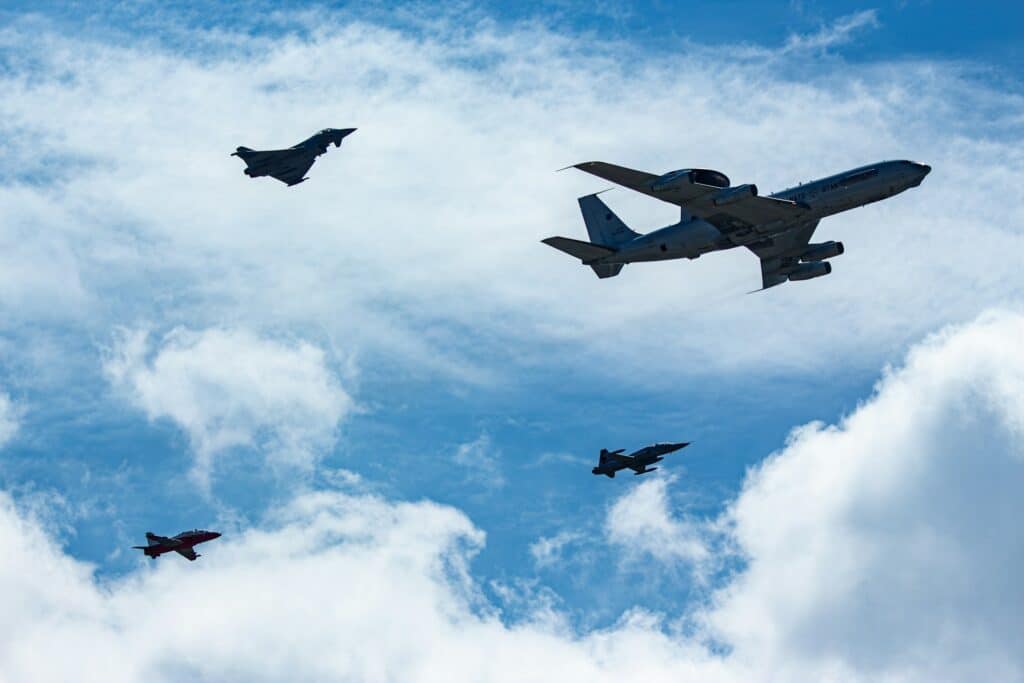 Fighter jets from different air forces flying together during exercise