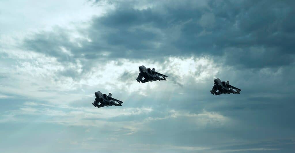 Military fighter aircraft flying in formation during training