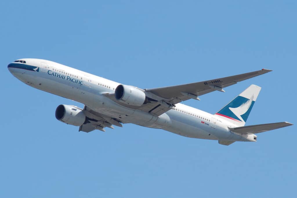 long haul airplane cruising at altitude over clouds