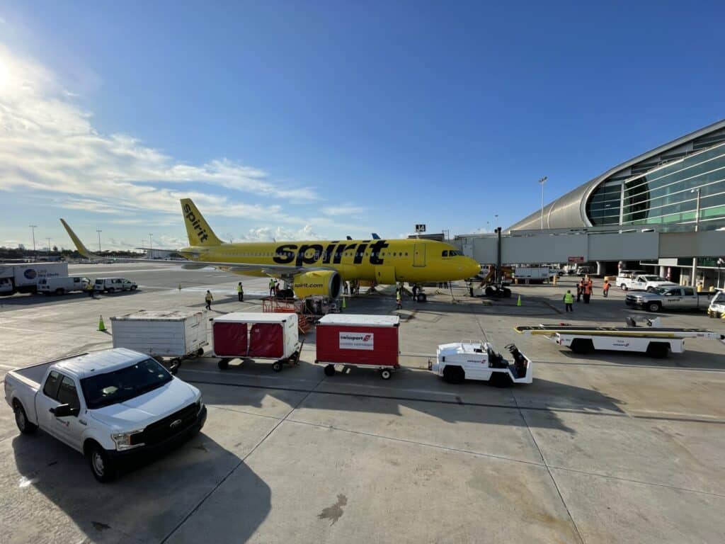 Spirit Airlines aircraft parked at airport terminal